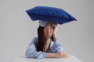 Woman sitting sleeplessly at a table