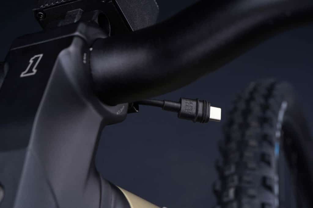 USB-C charging cable extending from the stem on the Serial 1 Bash/Mtn ebike