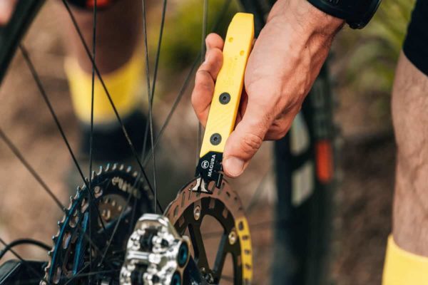 Aligning the rotor of the disc brake with the 8-Bit Tire Lever & Magura Disc Brake Tool