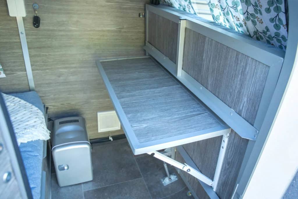 Folding table in the Hupi camping trailer for ebikes