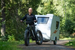 Designer Urpo "Upi" Merranmaa of the Hupi camping trailer for ebikes