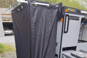 Curtain for solar shower on Tinyvroum Capsulbike camping trailer for ebikes