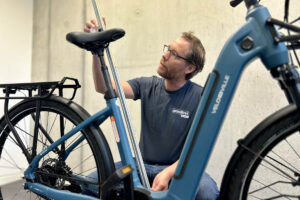 Measuring the saddle height along the seat tube during a bike fitting for ebikes