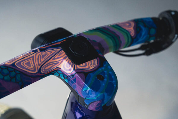 Colourfully painted handlebar-stem unit on an ebike