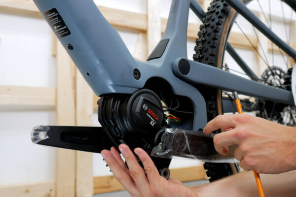 Removing the motor from the mount during installation of the Bosch Purion 400 display on an ebike featuring the Bosch Smart System