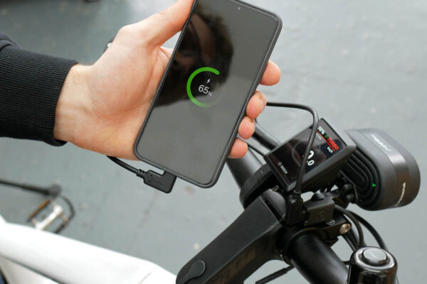 Charging a smartphone at the charging port Supernova USB-C Charger for ebikes